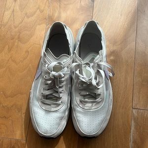Off white Nike Waffle sneakers. Barely worn size 9. Purple swoosh.